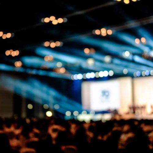 conference stage with audience in foreground