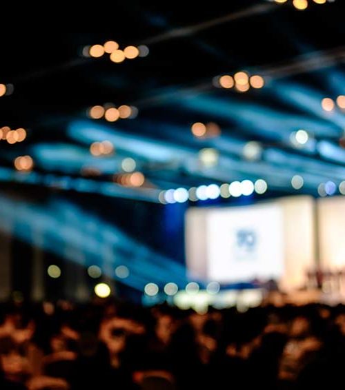 conference stage with audience in foreground