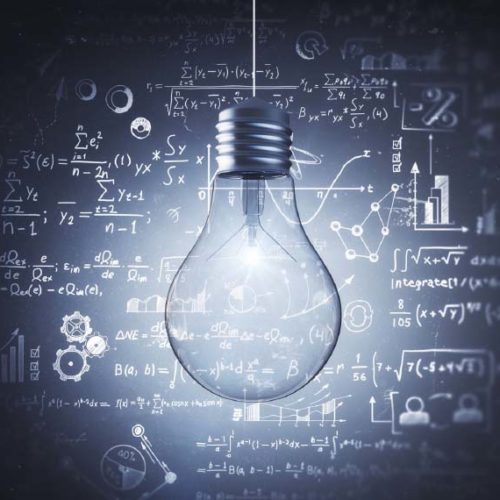 Light bulb with math equations on chalkboard