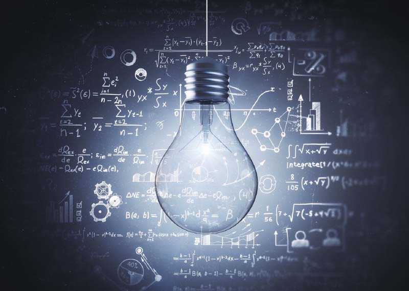 Light bulb with math equations on chalkboard