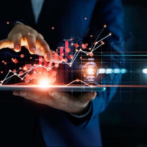 Man holding tablet with financial charts