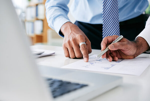 Wall street analyst looking at ARR segment reporting in business office
