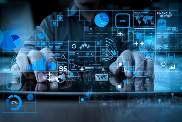 business man typing on keyboard with augmented reality view of financial metrics