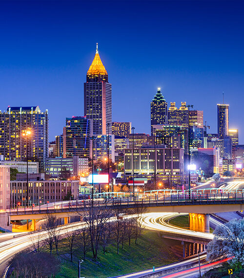 Atlanta skyline at dusk with highway in foreground