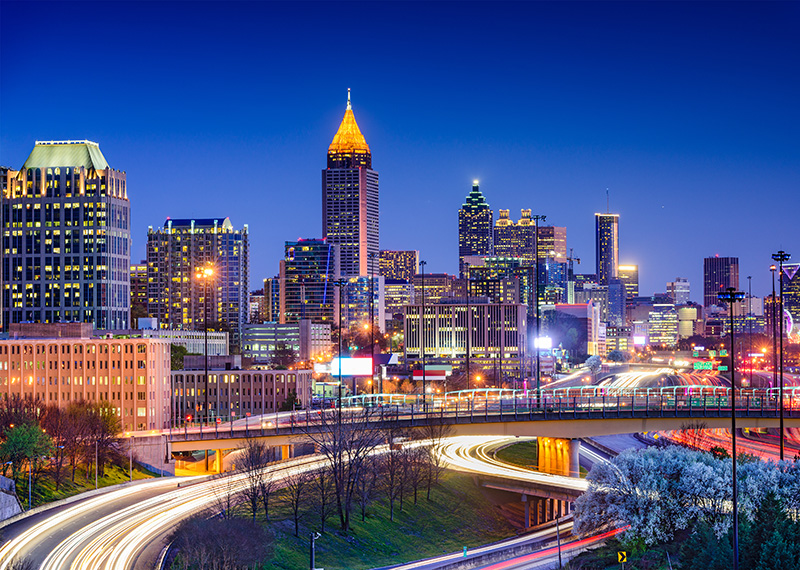 Atlanta skyline at dusk with highway in foreground