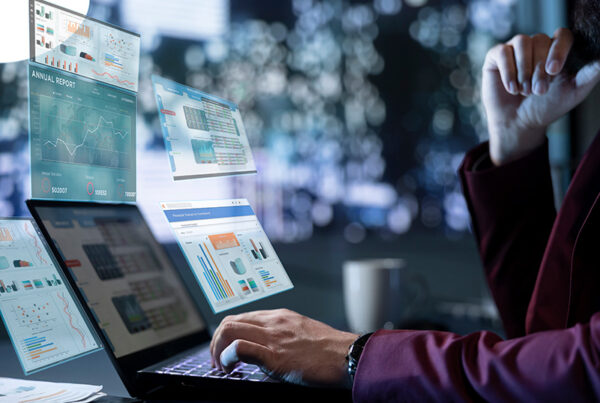business man reviewing retention and churn rate calculation charts
