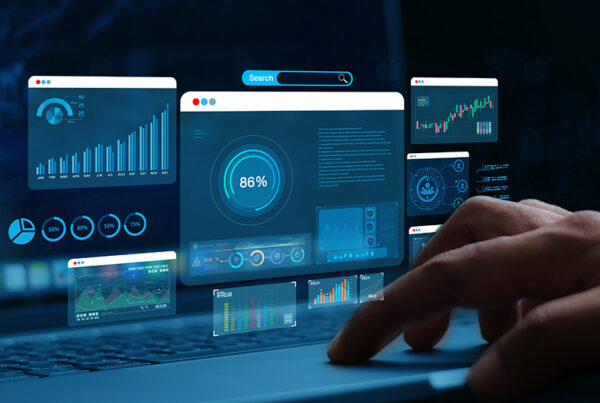 days sales outstanding charts showed on multiple monitors with accounts receivable clerk clicking on keyboard