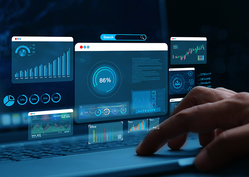 days sales outstanding charts showed on multiple monitors with accounts receivable clerk clicking on keyboard