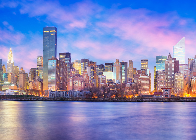 View of Manhattan at dusk site of the F-Suite CFO Scale Up Summit 2025