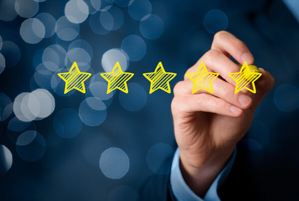 business man giving five star review for subscription billing software