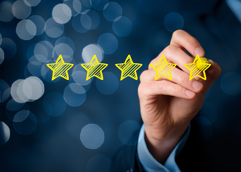 business man giving five star review for subscription billing software