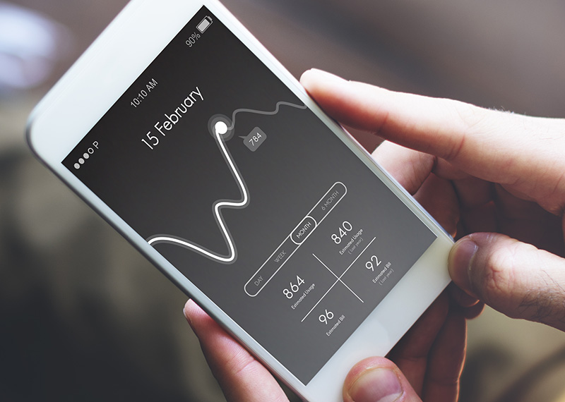 mobile phone with usage pattern displayed on screen and invoice charges below