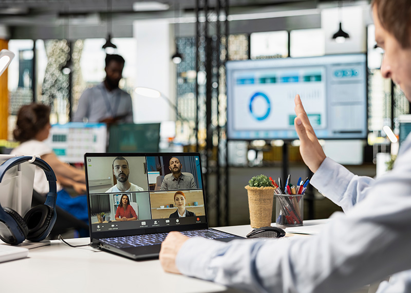 account executive on a virtual sales call with customers in video conference