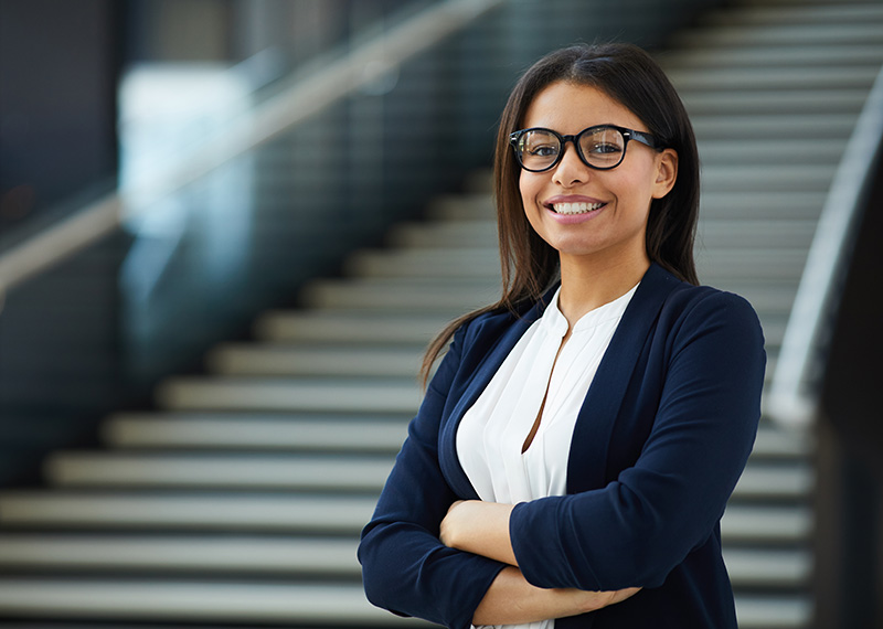 Product marketing manager standing in front of a stairway at corporate office