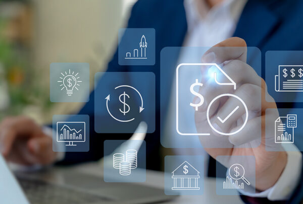 business man reviewing ai matched payments and invoices on laptop