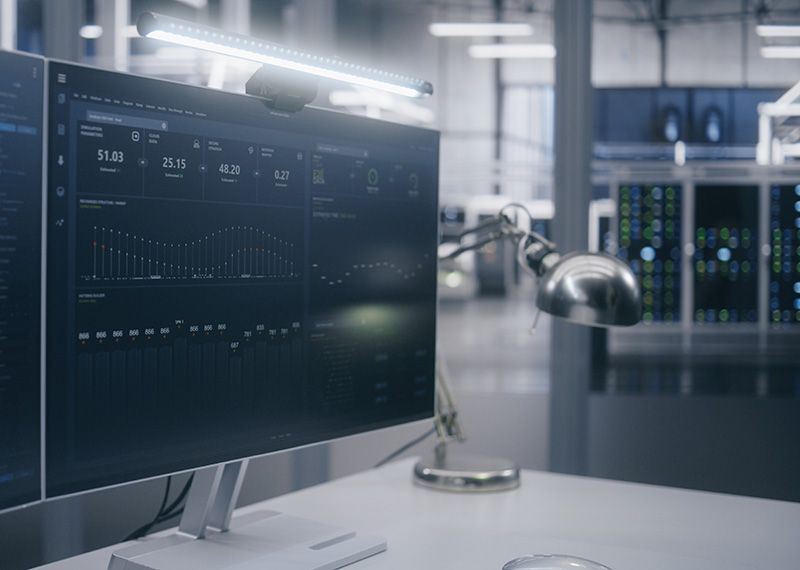 BECS direct debit payments on a large monitor with financial data center in background