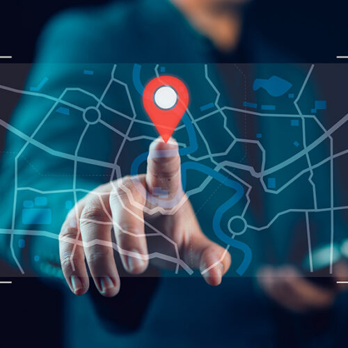 business man pointing to holographic map with finger on billing address