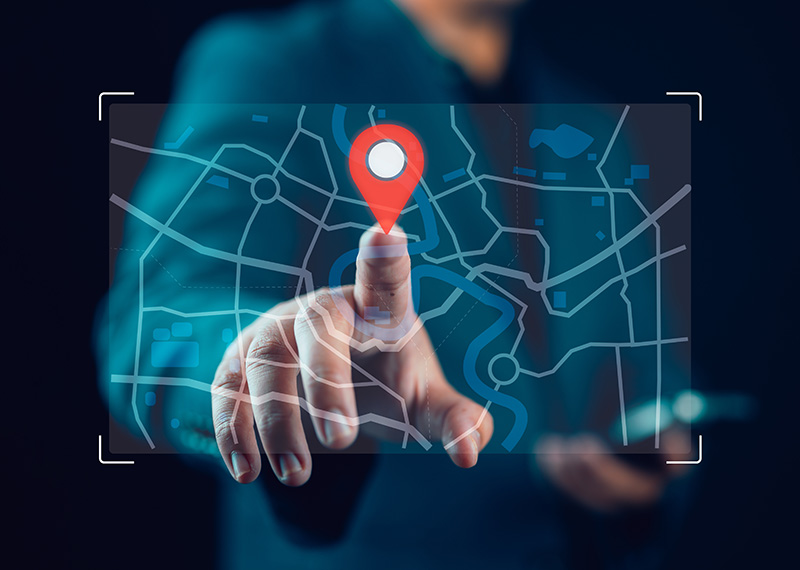 business man pointing to holographic map with finger on billing address