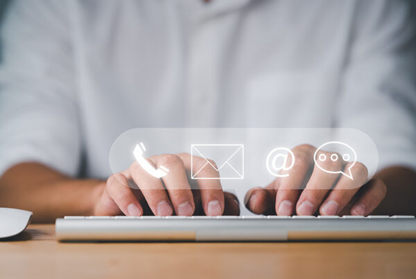 business man typing contact information into a billing portal