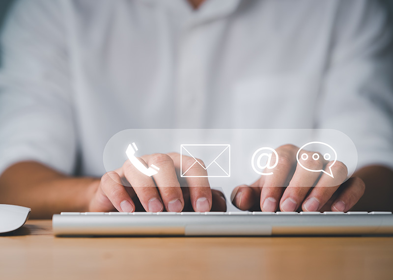 business man typing contact information into a billing portal