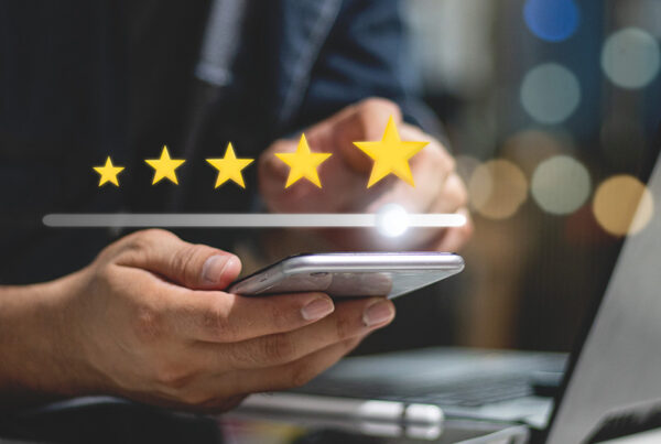 customer giving G2 five star customer review for subscription billing on mobile phone