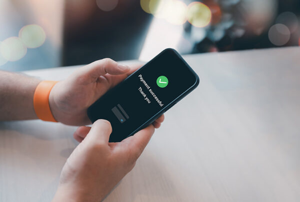 business woman using mobile phone to pay bill with Google Pay