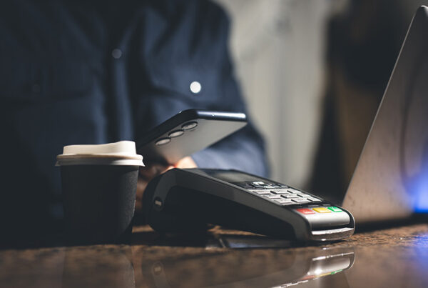 paying for coffee with smart phone digital wallet at point of sale