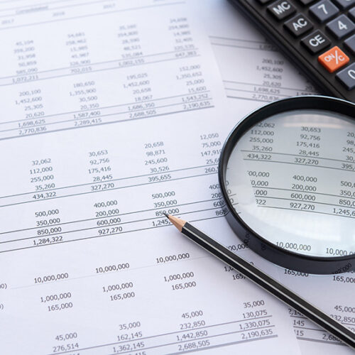 accounting general ledger with calculator and pencil
