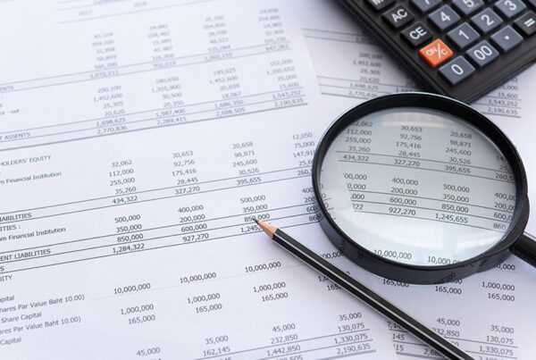 accounting general ledger with calculator and pencil