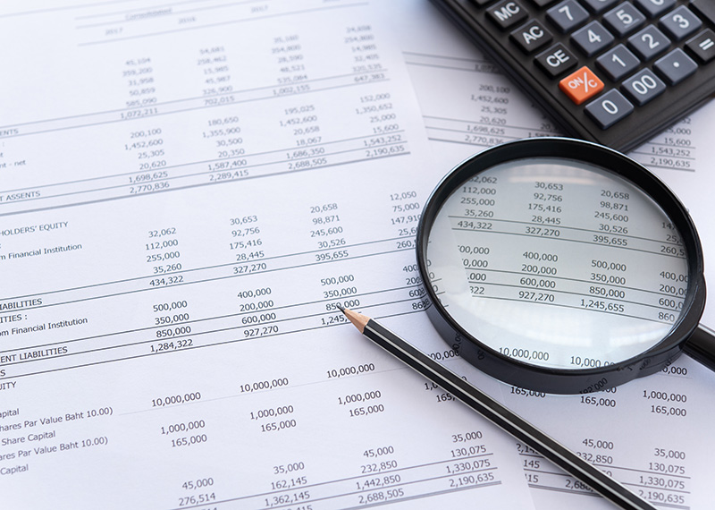 accounting general ledger with calculator and pencil