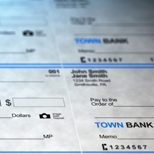 multiple checks ready for deposit in bank lockbox