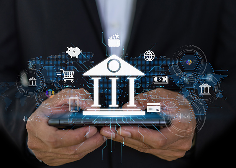 business man holding tablet with bank and faster payments illustration