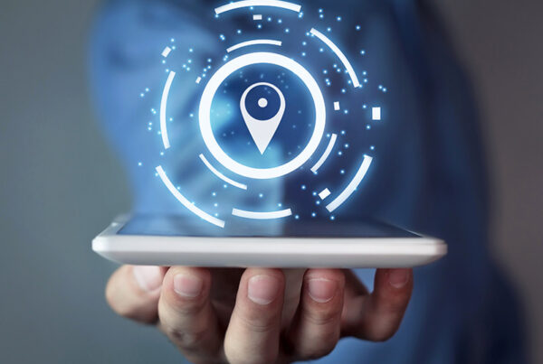 business man holding tablet computer with map pin highlighting shipping and billing address