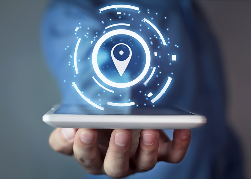 business man holding tablet computer with map pin highlighting shipping and billing address