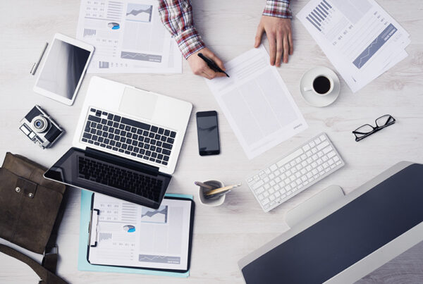 finance manager comparing subscription billing software to erp software at desk
