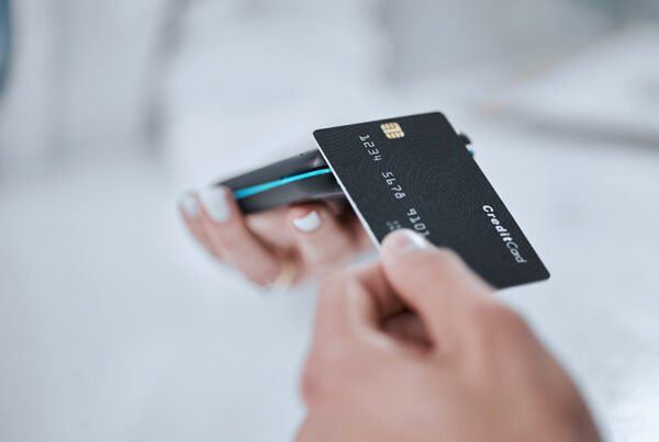 shopper making purchase with credit card at retail point of sale