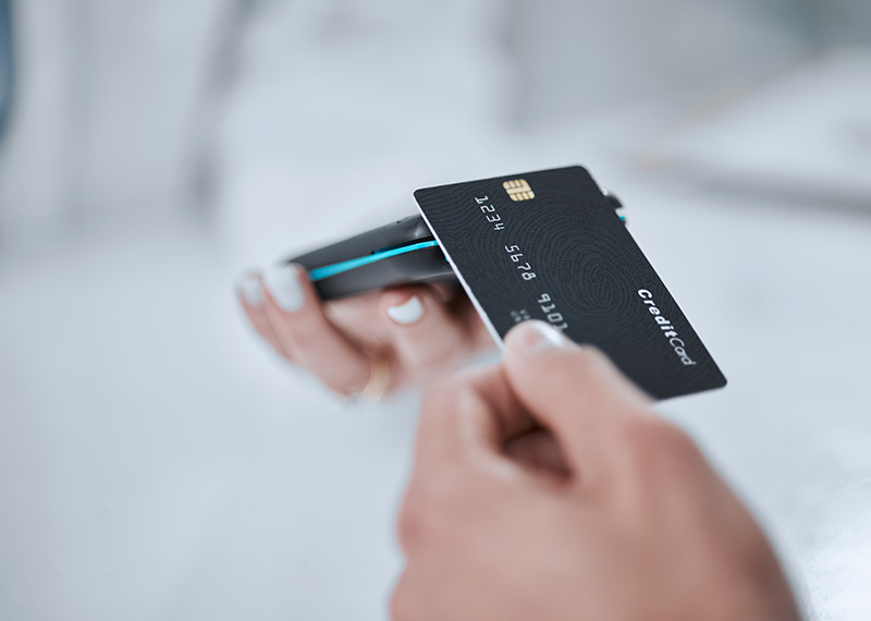 shopper making purchase with credit card at retail point of sale
