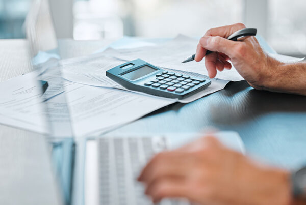 Accountant reviewing invoices for value added taxes