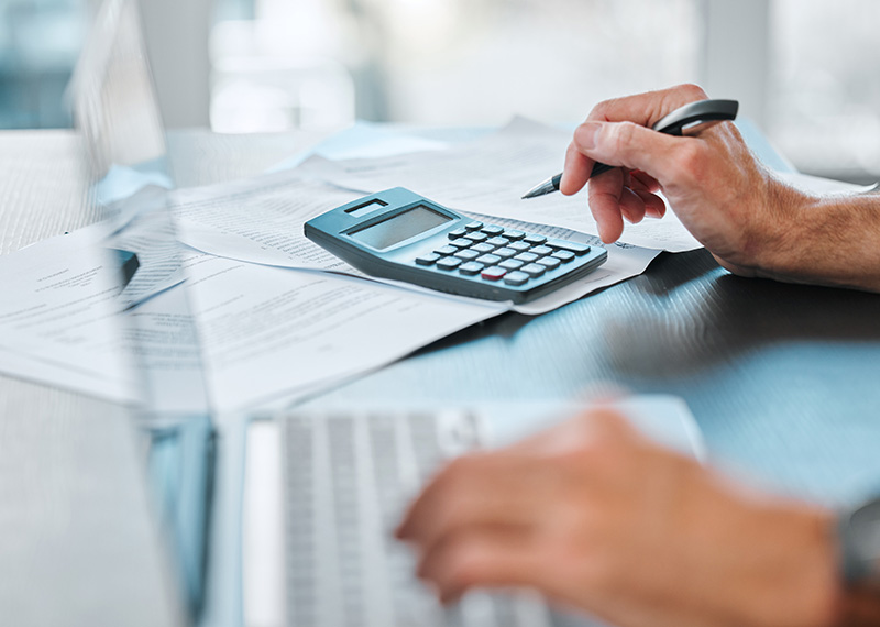 Accountant reviewing invoices for value added taxes