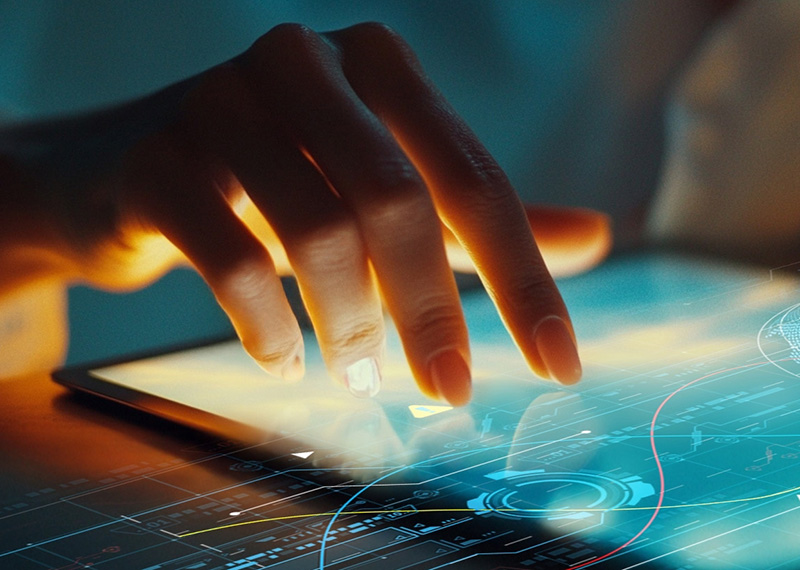 woman typing on tablet with CPQ software