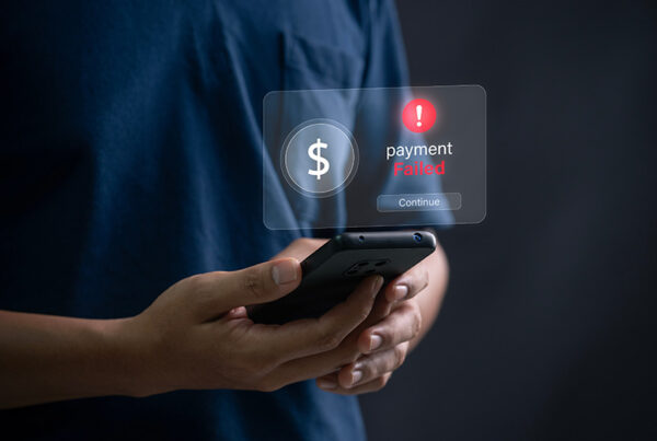 man holding smartphone viewing payment failure