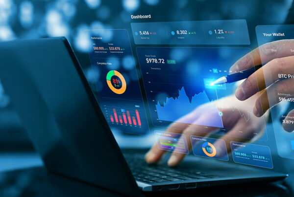 founder typing laptop with revenue sharing financial dashboard in foreground